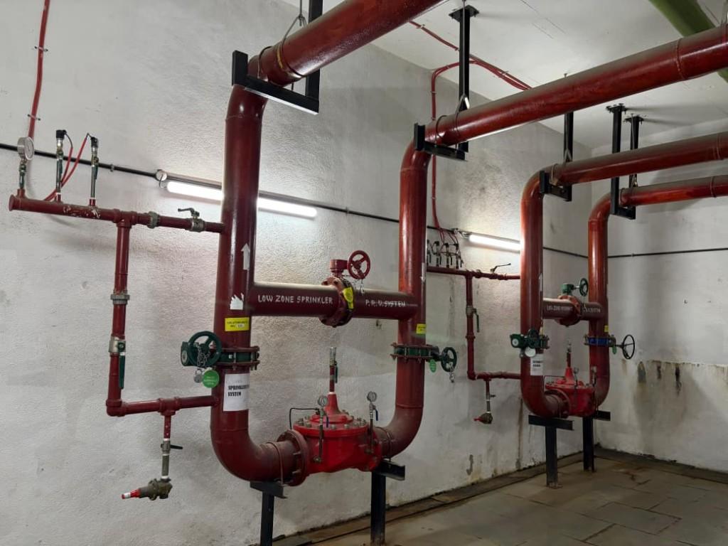Low zone sprinkler system piping and valves