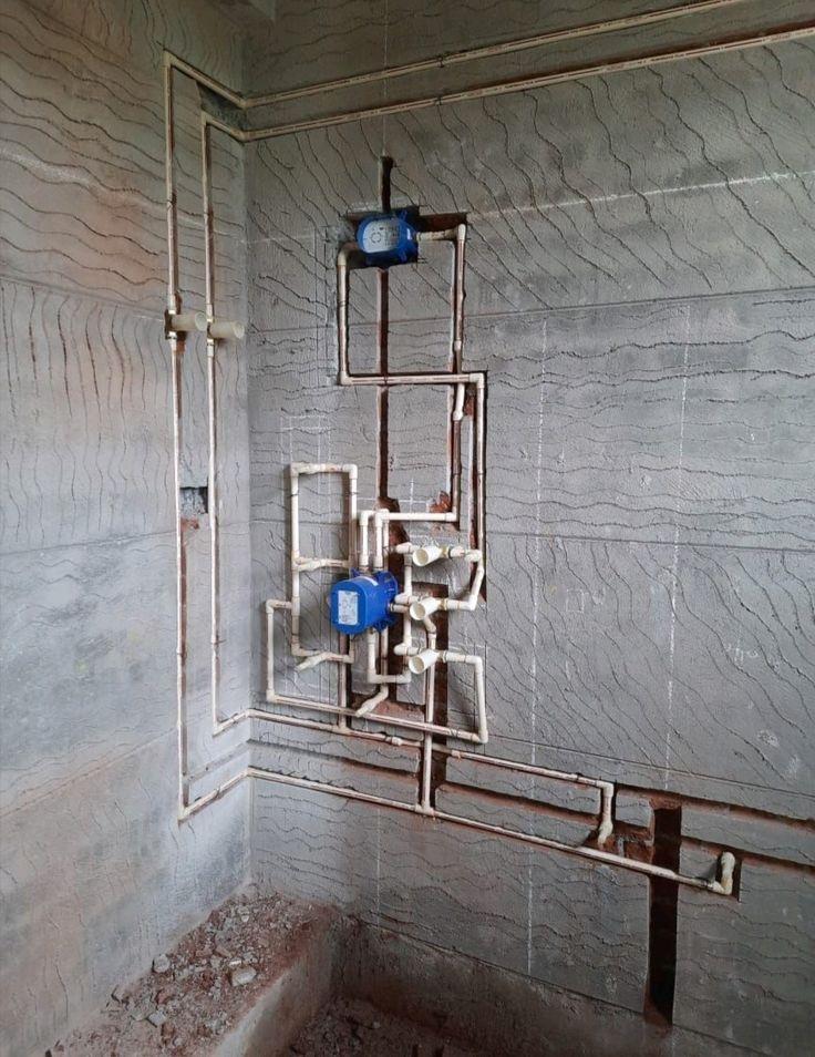 Internal plumbing layout with concealed pipes and meters