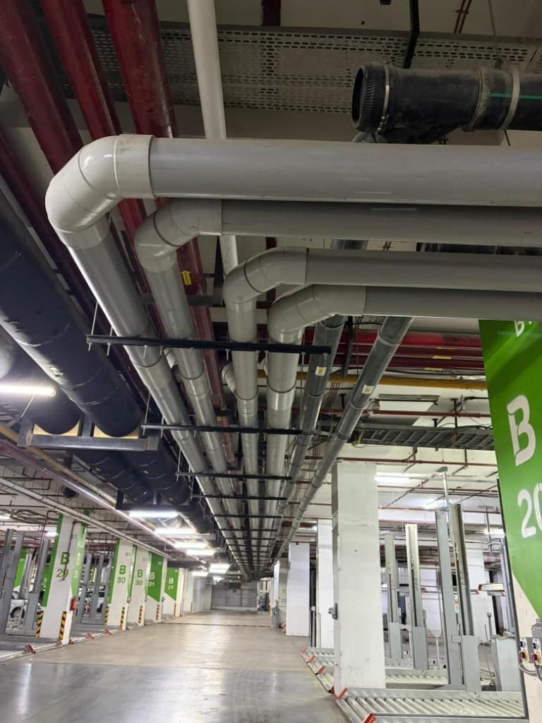 Overhead PVC distribution network in basement parking