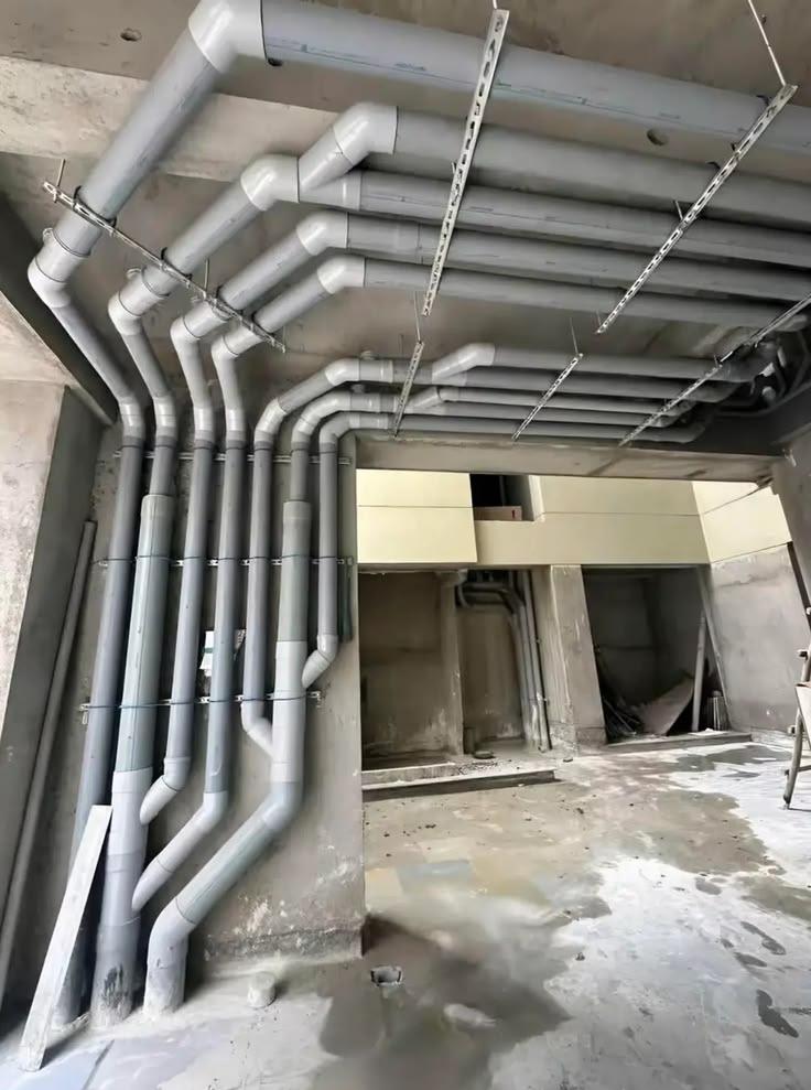 Plumbing risers and branching pipe network
